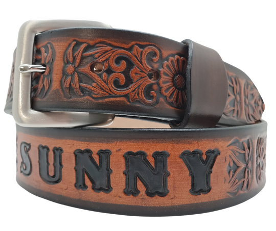 "The Sun Daisy" is a handmade real VEGTAN belt made from a single strip of cowhide shoulder leather that is 8-10 oz. or approx. 1/8" thick. It has hand burnished (smoothed) & edges and Summer flowers embossed on the surface. The antique nickel plated solid brass buckle is snapped in place with heavy snaps. This belt is made just outside Nashville in Smyrna, TN.