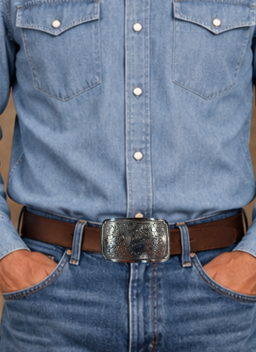 Rectangular antique silver colored belt buckle with Western style tooling, approx. size is 3 1/4" wide by 2" tall. Belt is made from zinc and is imported. Available online and at our shop just outside Nashville in Smyrna, TN.
