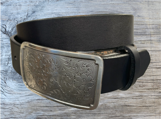 Rectangular antique silver belt buckle with western style tooling, size approx. 3" wide by 2 1/2" tall. Belt is handmade from a single strip of leather in our shop. Belt colors available are distressed brown, black, and dark brown. Buckle snaps in place for easy changing if desired.﻿ CHOOSE ONE BELT STRIP COLOR! Available online and at our shop just outside Nashville in Smyrna, TN.
