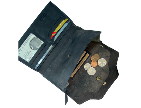 Leather Long Clutch Style Wallet with 4 card slots, I.D. slot, cash and coin pocket, zippered pocket. A convenient way to keep everything you need in one place! Imported and Buckle and Hide Approved! Available in Distressed Brown, Grey, Turquoise.