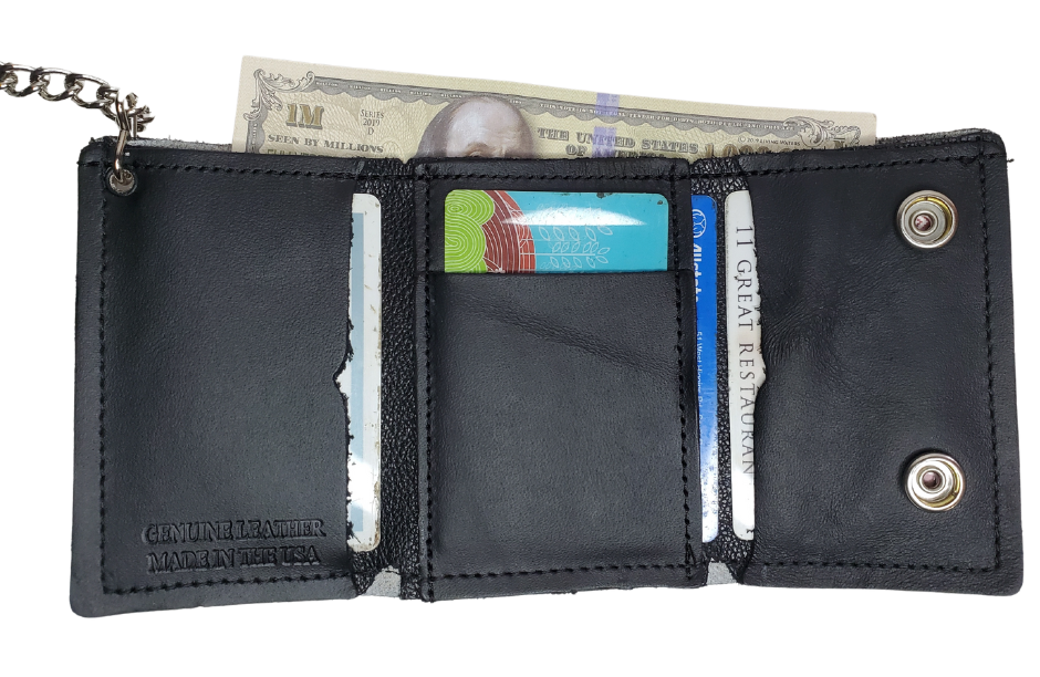 Skulls pattern all leather Tri-fold Chain Wallet. 1 Cash Slot for all your important stash, 3 card slots and 1 underneath the middle slot. It's USA made and Buckle and Hide approved. Approx. 3"x 4" folded. 2 snap closure. Complete with an 12" chrome plated chain including leather belt loop. Available in our Smyrna, TN shop a short drive from downtown Nashville. Like most wallets over stuffing will limit the time of use. Colors may vary from picture. 
