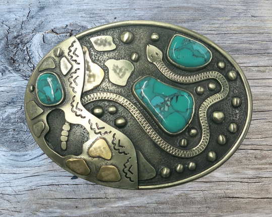 The Snake River buckle is made from German Silver (nickel and brass alloy) or iron metal base. Each piece is punched, cut, soldered, engraved, polished and painted by our talented metal workers.  Our products give you the quality and long for lasting final product. Available at our Smyrna, TN shop just outside of Nashville. Approx. Width 4” Height 3”