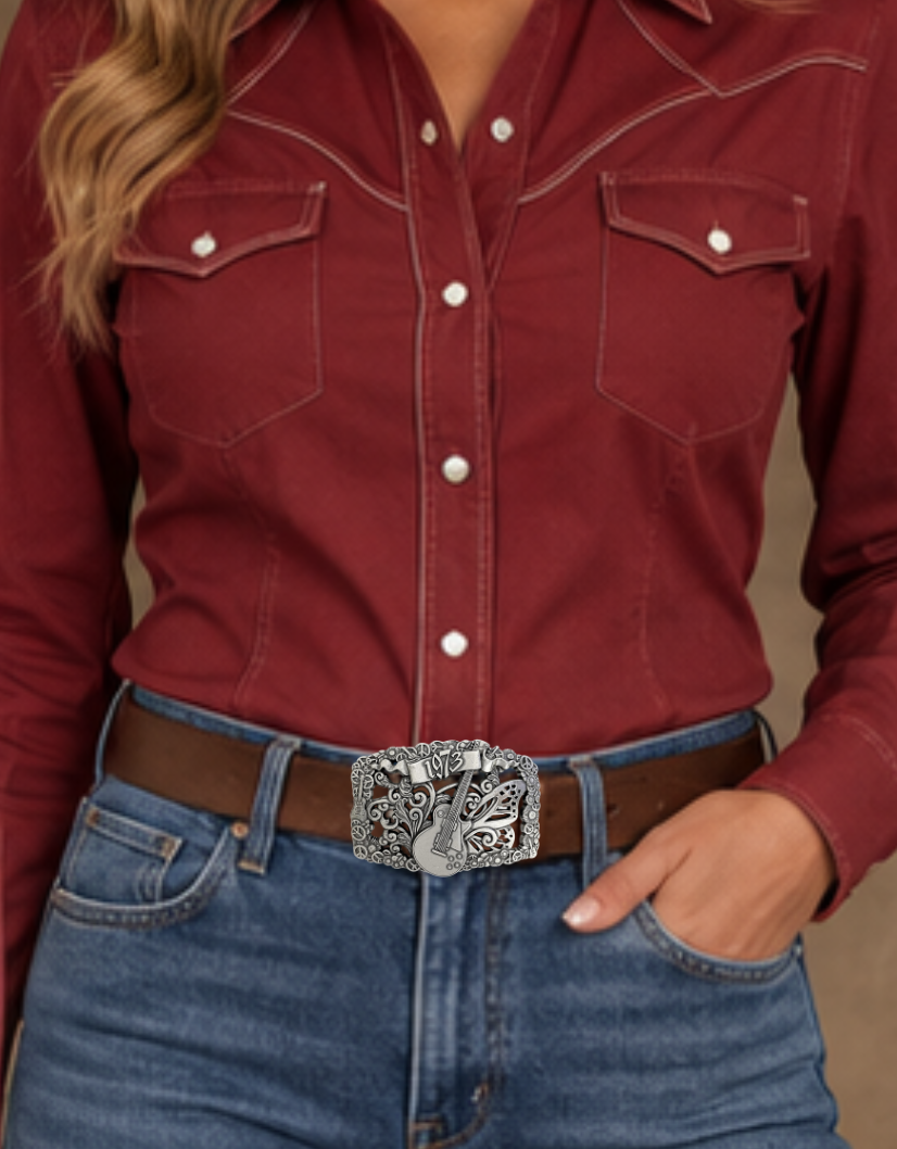 We named this after The 1973 concert featuring The Grateful Dead, Allman Brothers, &amp; The Band: and a HUGE crowd. The buckle has A Filigreed Butterfly, Peace signs, Les Paul guitar, Scroll and Flower designs in Antique Nickel color that looks great on plain 1 1/2" Black or Brown belt. A easy to wear oval shape that&