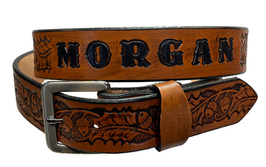 The Tall Oak Name Leather Belt is crafted from strong, high-quality Veg tan leather with an embossed Oak and Acorn pattern. Choose your finish and a name if desired. Its solid Antique nickel brass buckle is easy to change with included snaps, perfect for everyday wear. Handmade outside of Nashville in Smyrna, TN.