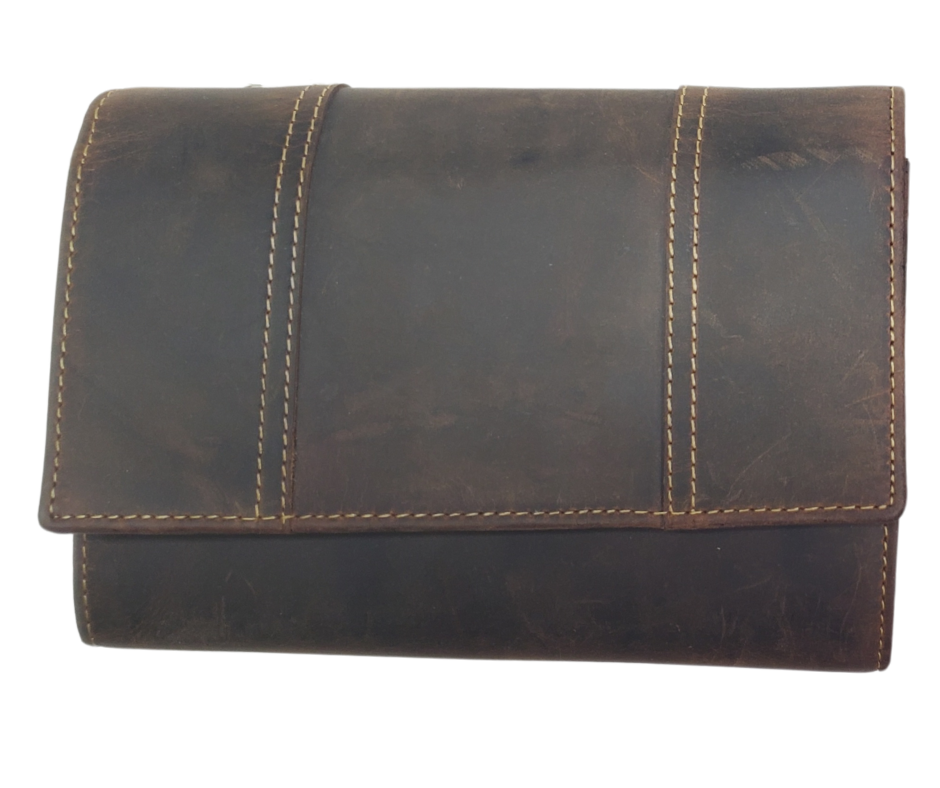 The Tiffany Crossbody Phone wallet is available at our Smyrna, TN shop not far from Nashville. This crossbody phone wallet has 2 accordion pockets, 1 zip pocket,6 additional card slots are placed in front of bag and is covered by flap with a magnetic catch. The inside flap has 5 card pockets and 1 window ID slot. Back of bag has half accordion zip pocket. Crossbody strap is detachable.
Bag size: 7.25” x 5”
4 internal card slots.
Choose from 4 colors