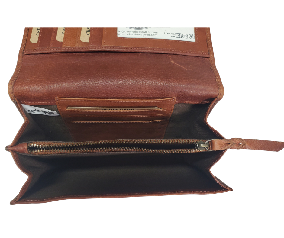 The Tiffany Crossbody Phone wallet is available at our Smyrna, TN shop not far from Nashville. This crossbody phone wallet has 2 accordion pockets, 1 zip pocket,6 additional card slots are placed in front of bag and is covered by flap with a magnetic catch. The inside flap has 5 card pockets and 1 window ID slot. Back of bag has half accordion zip pocket. Crossbody strap is detachable.
Bag size: 7.25” x 5”
4 internal card slots.
Choose from 4 colors