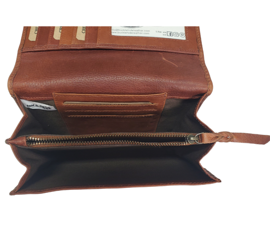 The Tiffany Crossbody Phone wallet is available at our Smyrna, TN shop not far from Nashville. This crossbody phone wallet has 2 accordion pockets, 1 zip pocket,6 additional card slots are placed in front of bag and is covered by flap with a magnetic catch. The inside flap has 5 card pockets and 1 window ID slot. Back of bag has half accordion zip pocket. Crossbody strap is detachable.
Bag size: 7.25” x 5”
4 internal card slots.
Choose from 4 colors