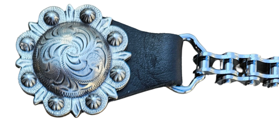 BUY 2 or more and SAVE! We call these our TITAN vest chains because of the large size conchos that are approximately DOUBLE sized! The screwed on conchos attach to a leather connector with snaps that fit most all vest. The Bike Style Chain also makes these unique to the typical traditional vest chains we offer. Ride on over to our Smyrna, TN store not far from Boswell&