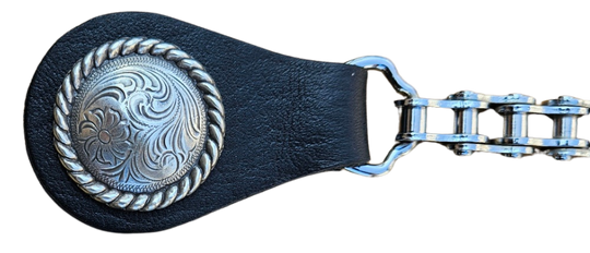 BUY 2 or more and SAVE! We call these our TITAN vest chains because of the large size conchos that are approximately DOUBLE sized! The screwed on conchos attach to a leather connector with snaps that fit most all vest. The Bike Style Chain also makes these unique to the typical traditional vest chains we offer. Ride on over to our Smyrna, TN store not far from Boswell&