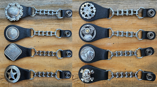BUY 2 or more and SAVE! We call these our TITAN vest chains because of the large size conchos that are approximately DOUBLE sized! The screwed on conchos attach to a leather connector with snaps that fit most all vest. The Bike Style Chain also makes these unique to the typical traditional vest chains we offer. Ride on over to our Smyrna, TN store not far from Boswell&