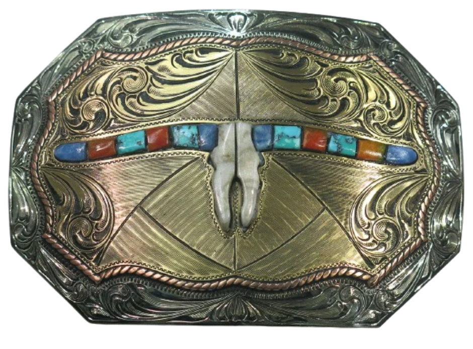 The Tumbleweed Belt Buckle has the ever classic Longhorn design accented with a multi colored stones. A Classic Western belt buckle at it's best! Made from German Silver and engraved and layered metals in a tri-color Western design. Available in our Smyrna, TN shop, a short distance from Nashville.

Dimensions: Width 4”, Height 2.7”
Standard 1.5” Swivel