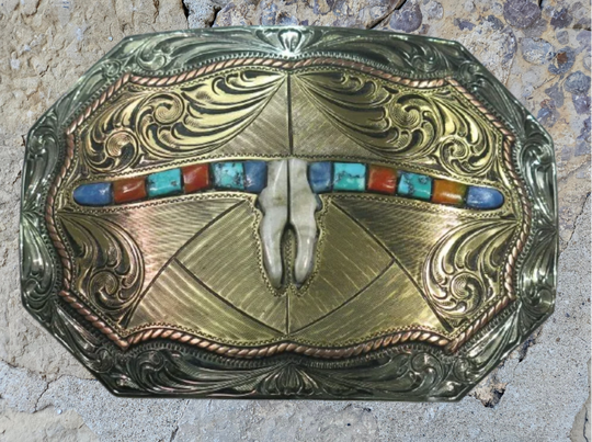 The Tumbleweed Belt Buckle has the ever classic Longhorn design accented with a multi colored stones. A Classic Western belt buckle at it&