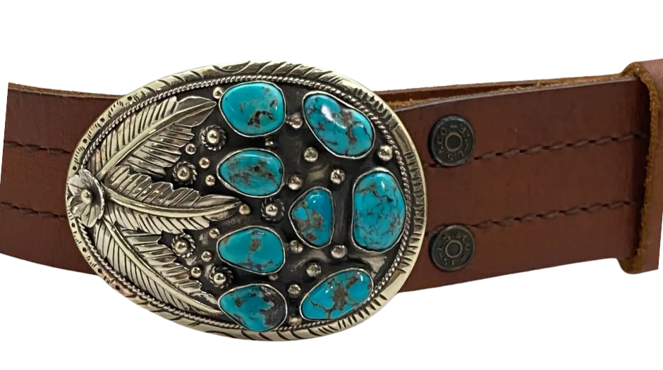 The Navajo influenced Turquoise Sky belt buckle&nbsp; It is crafted from white metal with turquoise and flowers on it and no 2 are alike because of the unique stones in each buckle. The measurement is approx. 3"x 4" and will fit up to 1 1 /2" belts. Ride on to our Smyrna, TN shop and check'em out!

Handcrafted in Nepal.
Floral design back