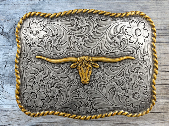 Bring iconic Western Texas Longhorn to your outfit with this classic belt buckle. Works with any leather snap-on belt from this site, or make your own for a custom look. Measurement: 3 1/8" x 2 3/8"; Fits 1 1/2" belts. Featuring a finish with antique-plated zinc with brass accented finish! Pick yours up at our Smyrna, TN shop a short Bull ride from downtown Nashville!