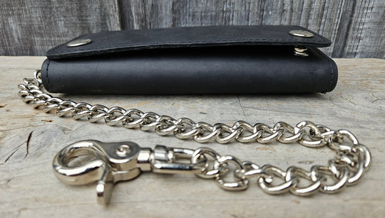 The Cruiser" 13 Pocket Chain Wallet has cards for almost everything. It has 3 folding sections to hold cards, money, receipts, and more!

Simple Black Tri-Fold Biker Wallet
13 Card Slots
1 Clear ID slot
Inside pocket with zipper
Secure Snap Closure
7.00” x 3.75"