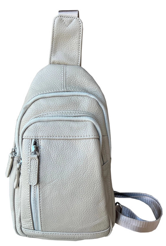 The Daily Carry Sling bag has two spacious main compartments. One main compartment has Interior throw pocket and 1 zipper pocket 1 exterior vertical zipper pocket on front side for your accessories. Backside has 1 vertical zipper pocket Metal loops are to adjust which side the strap attaches Adjustable shoulder strap, Leather pulls

Material: Cowhide leather Colors: black, cream, light brown
Size: 11 ¼”x 6½”x 3”