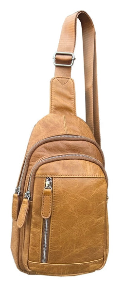 The Daily Carry Sling bag has two spacious main compartments. One main compartment has Interior throw pocket and 1 zipper pocket 1 exterior vertical zipper pocket on front side for your accessories. Backside has 1 vertical zipper pocket Metal loops are to adjust which side the strap attaches Adjustable shoulder strap, Leather pulls

Material: Cowhide leather Colors: black, cream, light brown
Size: 11 ¼”x 6½”x 3”