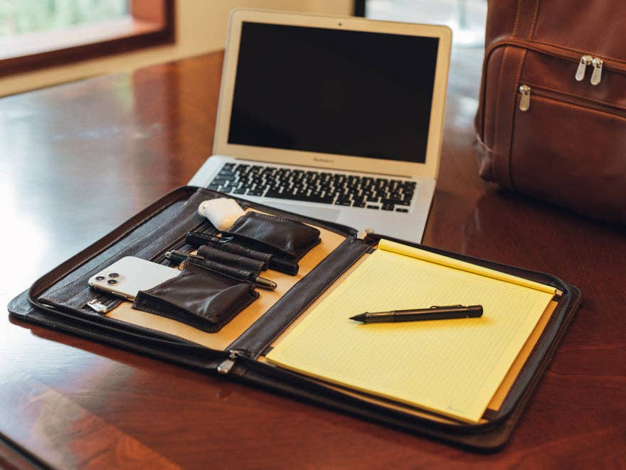 The Kinetic Padfolio is for the person on the go and needs the daily necessities all together and that helps you to focus on the task that each brings. Fully lined interior and Leather that improves with age as it absorbs the oils from your hands and assumes a classic, worn look with daily use. Now part of our Smyrna, TN shop not far from Franklin.

Zip-around with large exterior zip-pocket.
Three large open pockets for files.
Interior zip-pocket, Letter-size notepad slot.