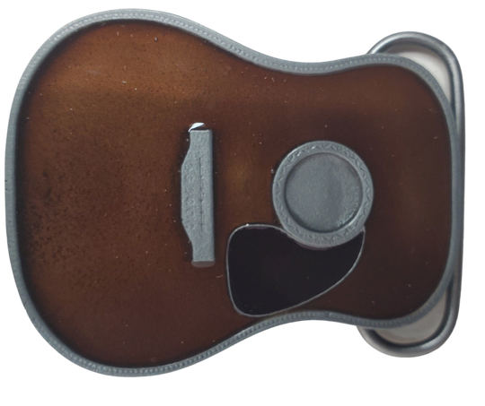 Strut your style with the iconic "Martin" Belt Buckle! This 2 1/2" tall by 3 1/2" wide buckle is fit for all music genres, from Rock to Bluegrass, Jazz to Folk. Let the world know your passion for playing guitar! Just outside of Nashville, home of the Acoustic Guitar, you can find the belt buckle in our Smyrna, TN shop online.