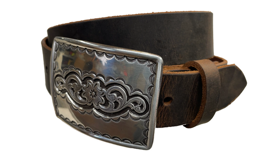 Rectangular antique silver belt buckle with western style tooling, size approx. 3" wide by 2 1/2" tall. Belt is handmade from a single strip of leather in our shop. Belt colors available are distressed brown, black, and dark brown. Buckle snaps in place for easy changing if desired.﻿ CHOOSE ONE BELT STRIP COLOR! Available online and at our shop just outside Nashville in Smyrna, TN. Main photo.