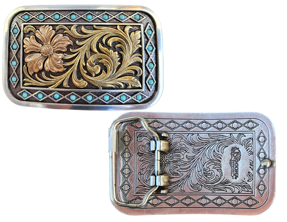The Occidental is a rectangle buckle with a pearl copper flower and antique gold scrolling in the center. Diamond shaped filigree with turquoise stones around the smooth edge. Pearl Copper Flower, Turquoise Stones on Edge. 98% Zinc, 1% Stone, 1% Iron. Approximate Size 2 x 3-1/2. You can find it at our retail shop in Smyrna, TN, located just outside of Nashville, or online.

Measuring 2" tall by 3 1/2" wide
Fit's belts up to 1 1/2" wide.
Imported