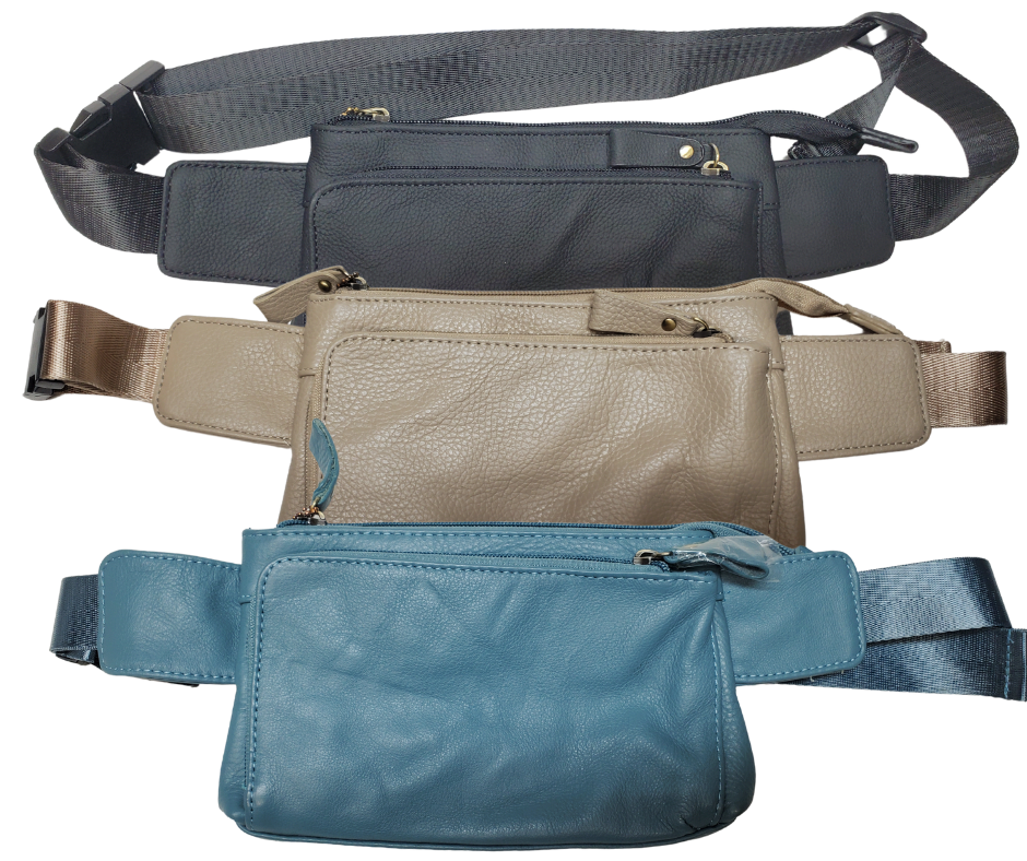 The on the Go Cowhide leather waist pack. Fully adjustable nylon waist belt with snap buckle closure. Two spacious main compartments, one with an interior zipper pocket. Back side has a discrete zipper pocket. Color match zipper and gold brushed hardware with leather pulls. Get yours at our local Smyrna, TN shop.

Cowhide genuine leather
Size: 8 ½” x 5” x ¾”
Front zipper pocket: 7” x 4 ½”
Waist length: adjust to 50 “
Color: Black, cream, light blue