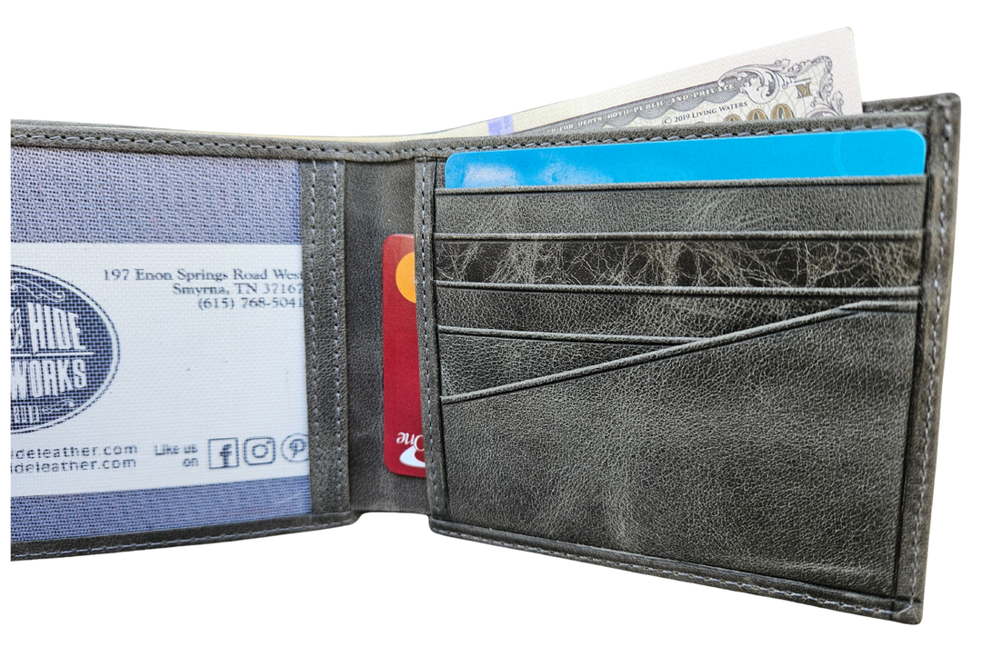 The Standard is a Premium Crazy Horse Leather Bifold Wallet. Known for its distinctive pull-up effect develops a rich patina over time — meaning every scratch, bend, and movement enhances its unique, rugged appearance. Built for everyday use, this wallet offers a slim yet highly functional layout without unnecessary bulk. Now in our Smyrna, TN shop not far rom the Gulch are of Nashville.