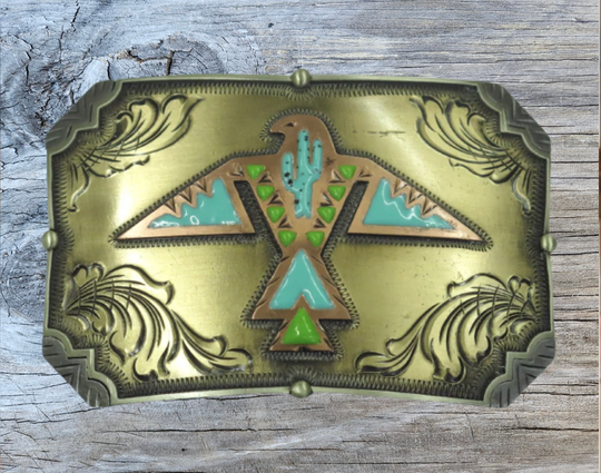 The Thunderbird Rising buckle is handmade from German Silver (nickel and brass alloy) or iron metal base. Our products are all handcrafted. In order to give you the quality and long lasting final product we also plate each piece with copper, nickel and silver. Available at our Smyrna, TN shop just outside of Nashville. Made in Mexico by talented metal workers.

Approx. Width 4” Height 3”/ Standard Swivel fits 1.5” belts