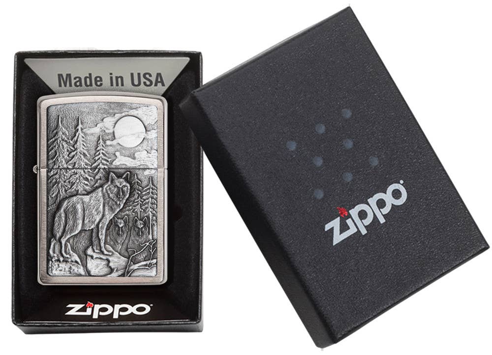 This Brushed Chrome windproof lighter has an emblem attached displaying a timber wolves in the wilderness. All metal construction; windproof design works virtually anywhere. Refillable for a lifetime of use. Comes packaged in a gift box. Available in our Smyrna, TN shop.

Made in USA
Fuel: Zippo lighter fuel (sold separately)
Lighter Specs: Height: 2.25" Width: 0.5" Depth: 1.5" Weight: 2.0 oz
Lifetime guarantee that "it works or we fix it free™" Zippo contact info on gift box.