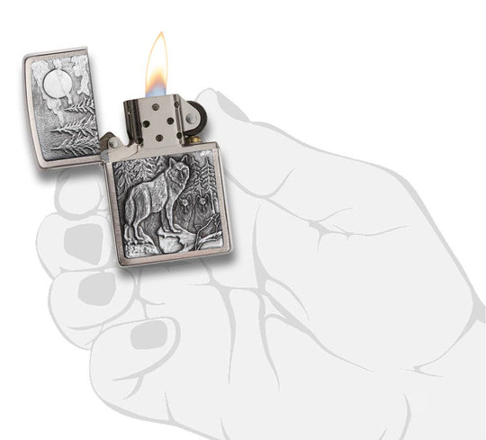 This Brushed Chrome windproof lighter has an emblem attached displaying a timber wolves in the wilderness. All metal construction; windproof design works virtually anywhere. Refillable for a lifetime of use. Comes packaged in a gift box. Available in our Smyrna, TN shop.

Made in USA
Fuel: Zippo lighter fuel (sold separately)
Lighter Specs: Height: 2.25" Width: 0.5" Depth: 1.5" Weight: 2.0 oz
Lifetime guarantee that "it works or we fix it free™" Zippo contact info on gift box.