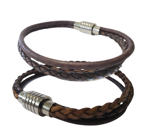This 3 color braided leather bracelet features Three Strands of Fine Imported Quality Leather Cord. This unique cord is made by braiding 8 individual strands of leather. A secure stainless steel magnetic closure clasp serves as a magnificent visual center piece. Available at Buckle and Hide leather in Smyrna, TN.