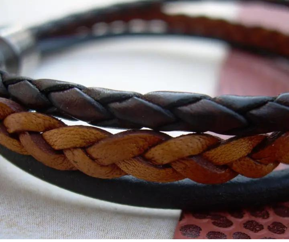 This 3 color braided leather bracelet features Three Strands of Fine Imported Quality Leather Cord. This unique cord is made by braiding 8 individual strands of leather. A secure stainless steel magnetic closure clasp serves as a magnificent visual center piece. Available at Buckle and Hide leather in Smyrna, TN.