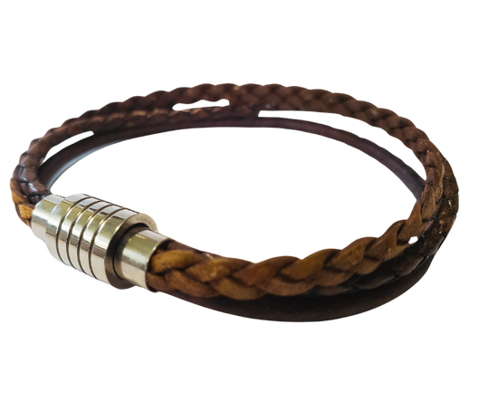 This 3 color braided leather bracelet features Three Strands of Fine Imported Quality Leather Cord. This unique cord is made by braiding 8 individual strands of leather. A secure stainless steel magnetic closure clasp serves as a magnificent visual center piece. Available at Buckle and Hide leather in Smyrna, TN.