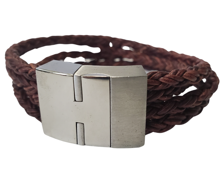 This  leather bracelet style features Four strands of braided 5mm High Quality Leather Cord. This unique cord is made by braiding 8 individual strands of leather. A secure slide magnetic clasp serves as a magnificent visual center piece. Available at Buckle and Hide leather in Smyrna, TN.