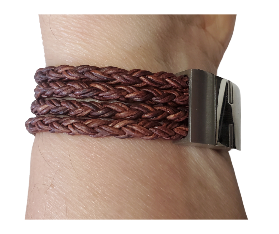 This  leather bracelet style features Four strands of braided 5mm High Quality Leather Cord. This unique cord is made by braiding 8 individual strands of leather. A secure slide magnetic clasp serves as a magnificent visual center piece. Available at Buckle and Hide leather in Smyrna, TN.