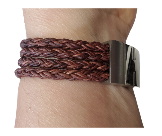 This  leather bracelet style features Four strands of braided 5mm High Quality Leather Cord. This unique cord is made by braiding 8 individual strands of leather. A secure slide magnetic clasp serves as a magnificent visual center piece. Available at Buckle and Hide leather in Smyrna, TN.