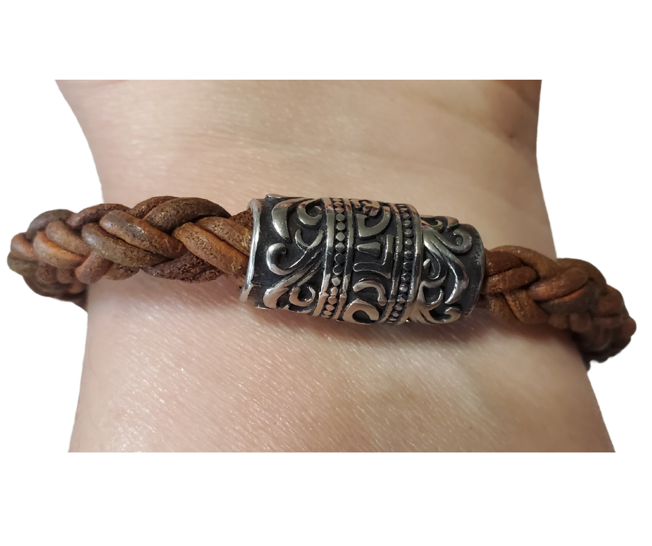 This features Thick 8mm Premium Quality Braided Leather Cord. This unique cord is made by braiding 8 individual strands of leather. Filigreed stainless steel magnetic clasp serves as a magnificent visual center piece. Available at Buckle and Hide leather in Smyrna, TN.