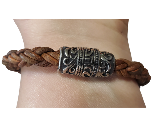 This features Thick 8mm Premium Quality Braided Leather Cord. This unique cord is made by braiding 8 individual strands of leather. Filigreed stainless steel magnetic clasp serves as a magnificent visual center piece. Available at Buckle and Hide leather in Smyrna, TN.