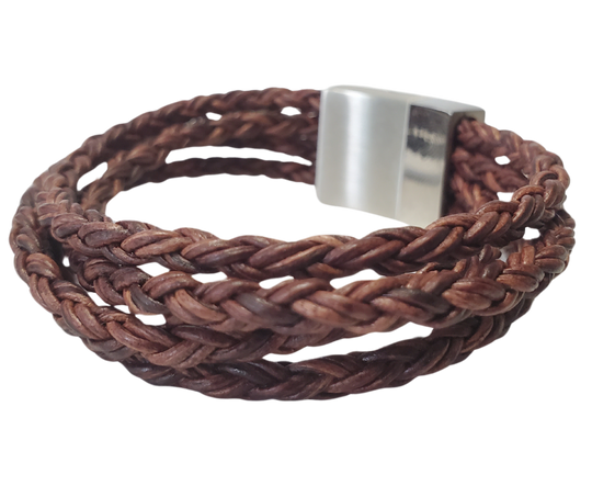 This  leather bracelet style features Four strands of braided 5mm High Quality Leather Cord. This unique cord is made by braiding 8 individual strands of leather. A secure slide magnetic clasp serves as a magnificent visual center piece. Available at Buckle and Hide leather in Smyrna, TN.