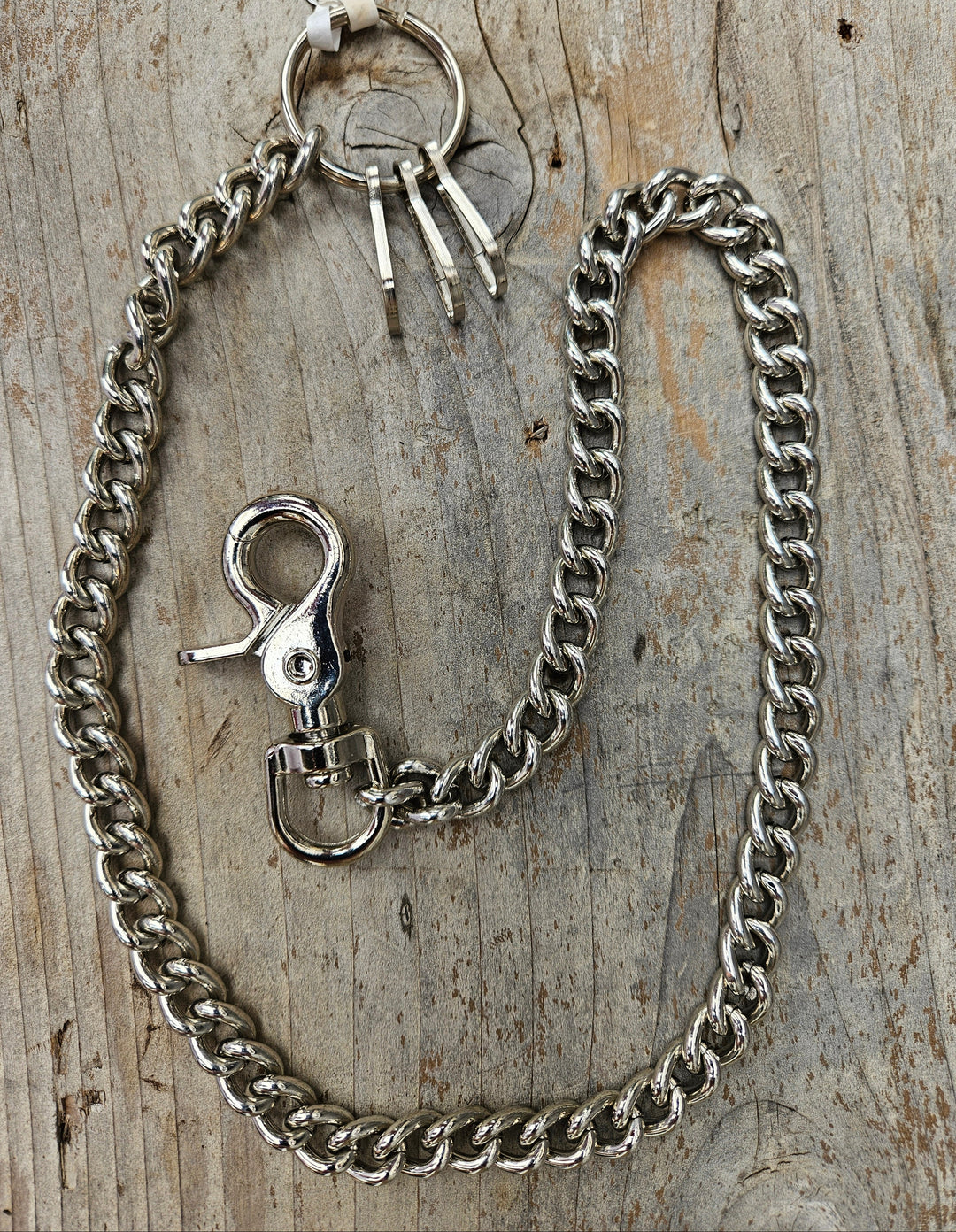The Unchained is a steel Wallet Chain, Simple but Sturdy, and will keep your wallet where it needs to be. Carry some some extra keys or stuff with the extra 3 clips. The sturdy scissor clip attaches to your jeans and the split ring attaches to your wallet. Chrome plated.&amp;nbsp; Ride down and get yours in our shop just outside Nashville in Smyrna, TN.

Available in 18" Length and 24" Length