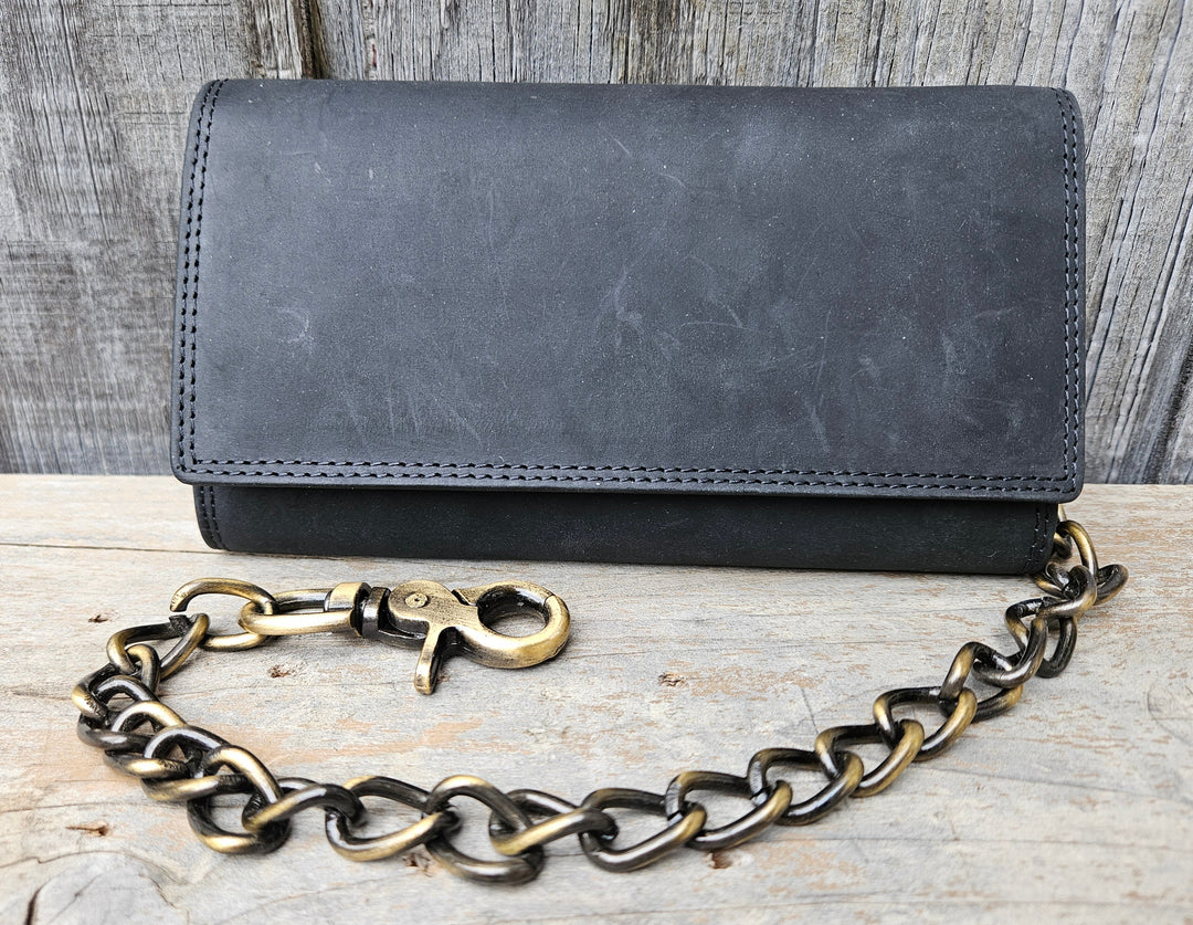 Popular Long Style RFID Secure Tri-fold Chain Wallet. 3 underneath cash slots, 15 card slots, I.D. slot, zippered pocket for all your important stash. Will darken with a nice patina with use. It&