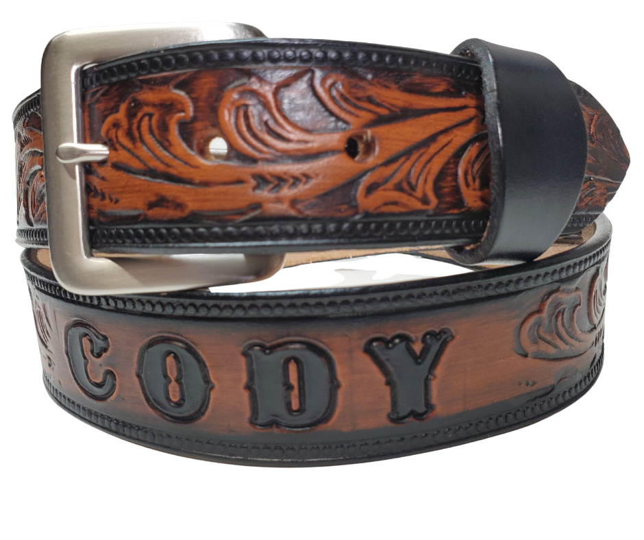 The Waggoneer Name Belt is a Classic Scroll pattern that will lift any look you going for. Embossed Western floral with a bead border. Made from approx. 9/10 oz. veg-tan cowhide with 2 snaps for easy buckle change. Made in our Smyrna, TN shop. If you visiting from outa town stop by and visit us.