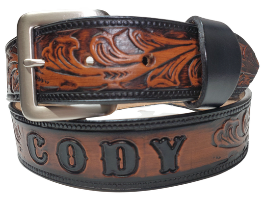 The Waggoneer Name Belt is a Classic Scroll pattern that will lift any look you going for. Embossed Western floral with a bead border. Made from approx. 9/10 oz. veg-tan cowhide with 2 snaps for easy buckle change. Made in our Smyrna, TN shop. If you visiting from outa town stop by and visit us.