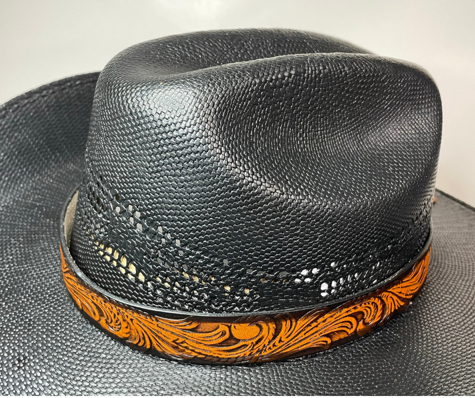 <p>A classic Western Styled pattern <b><i>Hand Stained</i></b> leather hatband. Band is 1" wide will fit up to size 7 1/2 hat. Matches our Rustler Belt. Fit's most any hat with adjustable bead and leather 1/8" string. Will fit most WESTERN crowned hats. Made in our Smyrna, TN. shop a short drive from downtown Nashville, TN.</p> <p>&nbsp;</p>