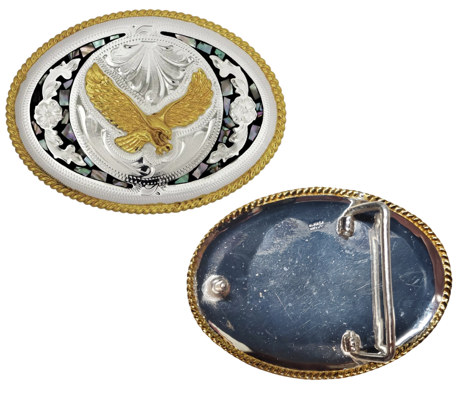 The "Isaiah's Eagle" belt buckle is a stylish showstopper. Crafted from German Silver with a brass overlay and shimmering abalone inlay, it showcases a soaring eagle framed by a rope-edged oval. Designed to fit belts up to 1 3/4" wide, this 4" x 3" buckle adds a bold touch to any outfit. Made in China and available at our Smyrna, TN shop near Nashville, it’s the perfect blend of flair and craftsmanship.