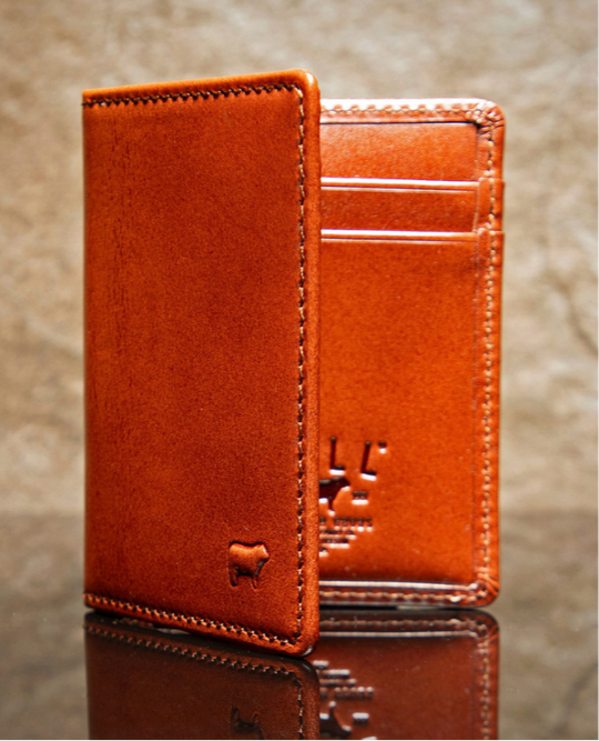 Italian Full Grain Veg-Tan is some of the finest leather in the world. Yes it cost more but when you want the best your willing to pay a bit more. Smooth and soft Italian calfskin with a glossy finish in Whiskey. 6 card slots 2 inside/2 outside, 3 under pockets. It's compact 4" x 3" size is right size for your daily needs. Now stocked at our Smyrna, TN store not far from Famous. Made by Will Leather, Imported.