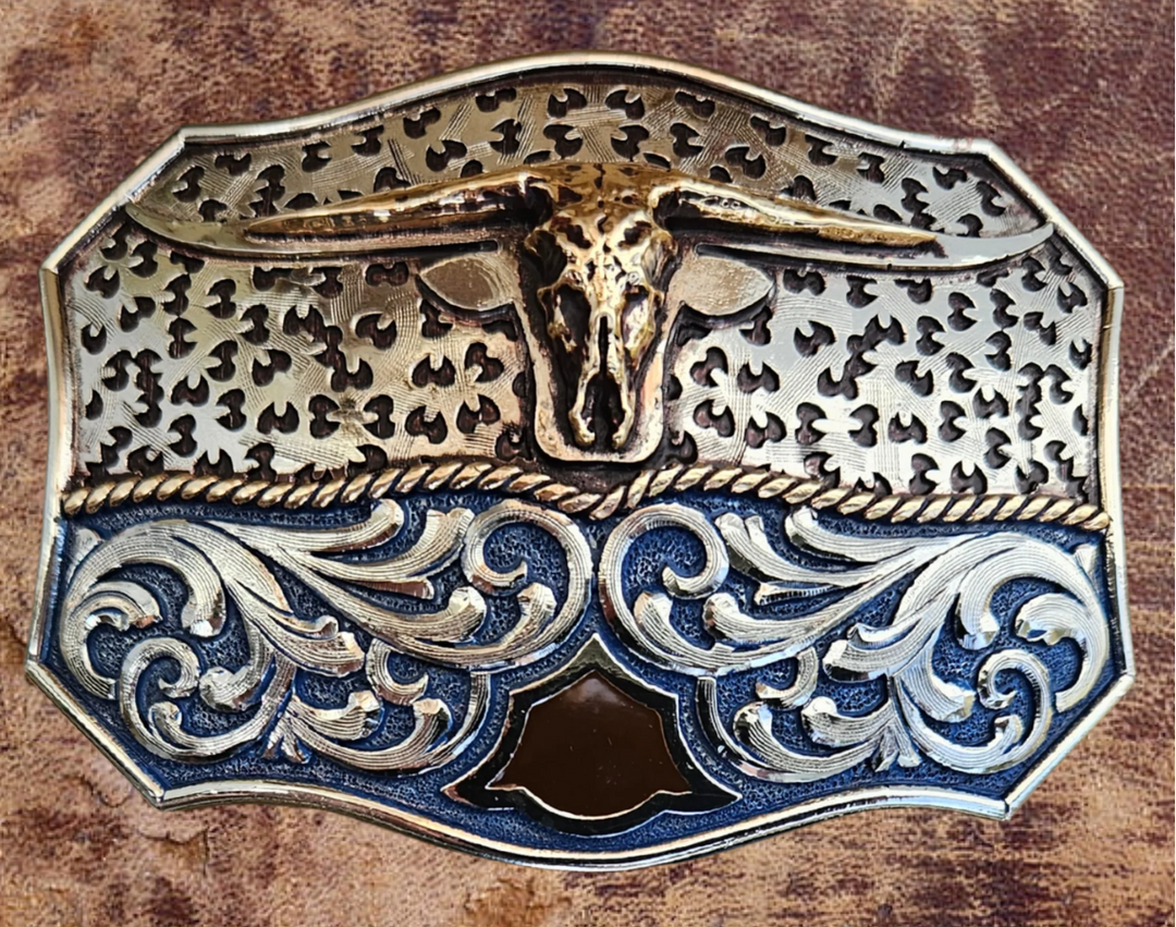 The Winter Wind Belt Buckle has the ever classic Longhorn design accented with a multi Western design influences like scrolls with a blue background with a touch of Dark brown. A Classic Western belt buckle at it&
