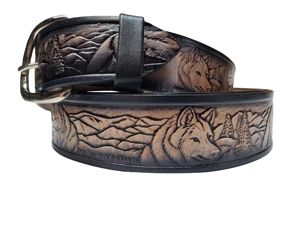 This all leather belt features a Wolf Pack pattern in an antiqued finish with a 1 1/2" width. It is crafted from full grain veg-tanned cowhide, with smooth burnished painted edges and a nickel-plated buckle. The buckle can be easily interchanged as well. This product is in stock at our Smyrna, TN shop. 