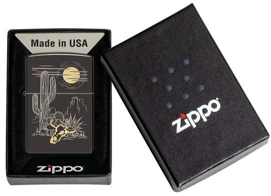 A Western two-tone design. Barren landscape laser etched onto a High Polish Black lighter, incorporating subtle touches of brass. All metal construction; windproof design works virtually anywhere. Refillable for a lifetime of use. Comes packaged in a gift box. Available in our Smyrna, TN shop.

Made in USA
Fuel: Zippo lighter fuel (sold separately)
Lighter Specs: Height: 2.25" Width: 0.5" Depth: 1.5" Weight: 2.0 oz
Lifetime guarantee that "it works or we fix it free™" Zippo contact info on gift box.