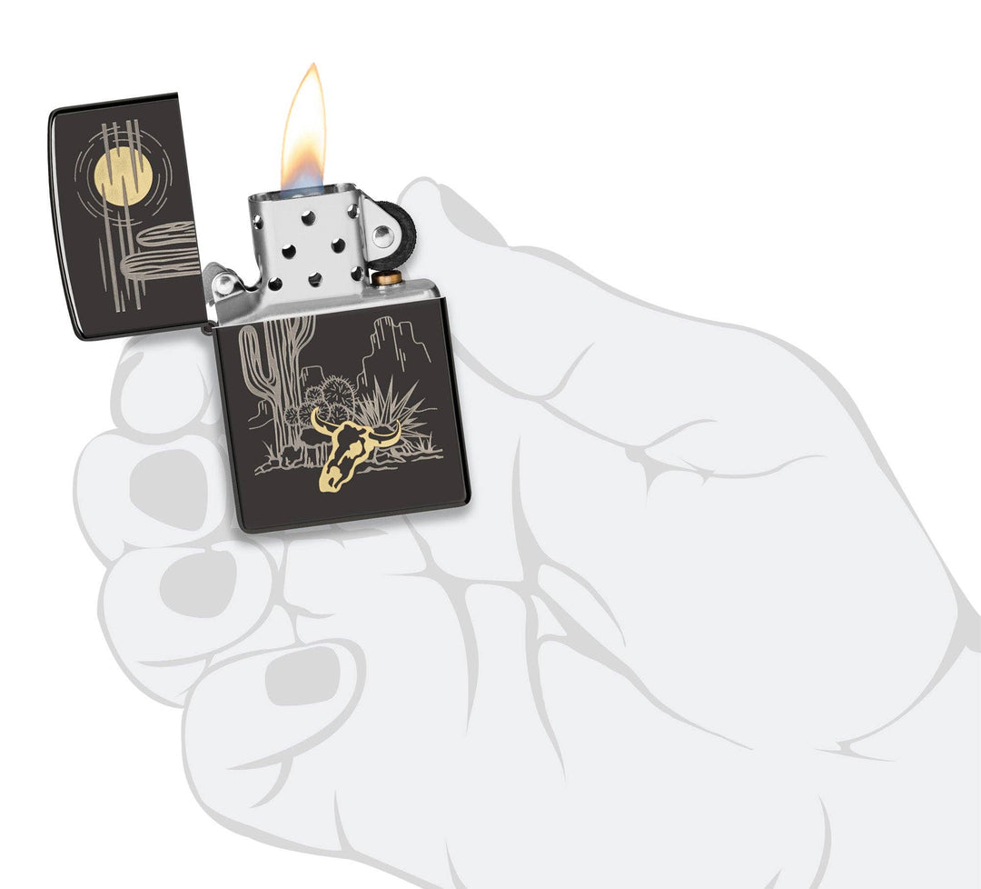 A Western two-tone design. Barren landscape laser etched onto a High Polish Black lighter, incorporating subtle touches of brass. All metal construction; windproof design works virtually anywhere. Refillable for a lifetime of use. Comes packaged in a gift box. Available in our Smyrna, TN shop.

Made in USA
Fuel: Zippo lighter fuel (sold separately)
Lighter Specs: Height: 2.25" Width: 0.5" Depth: 1.5" Weight: 2.0 oz
Lifetime guarantee that "it works or we fix it free™" Zippo contact info on gift box.